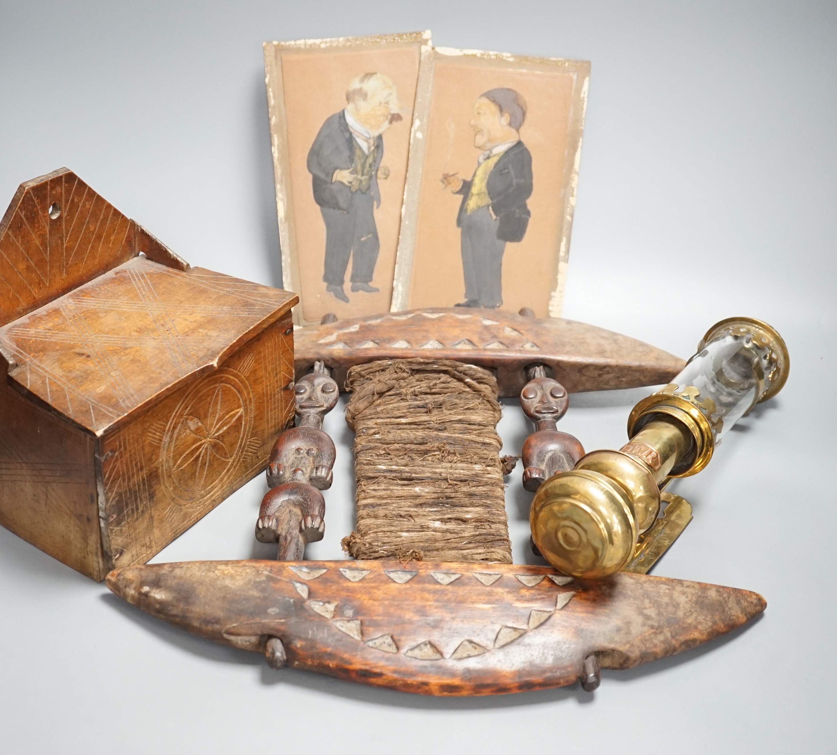 African carved wood instrument, chip carved beech box, a GWR brass wall lamp and a pair of oil portraits of H Belloc and HG Wells
